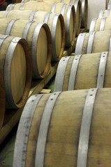 Closeup of  wooden barrels for maturing and storing wine 1