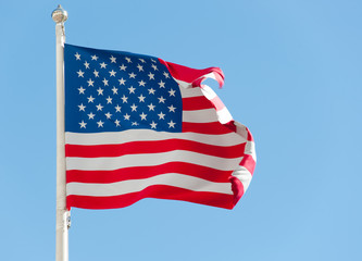 American flag against blue sky
