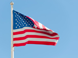 American flag against blue sky