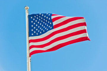 Obraz premium American flag against blue sky