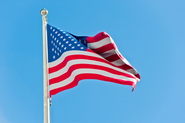 American flag against blue sky