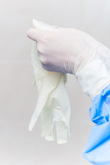 Fototapeta premium Doctor puts on surgical gloves