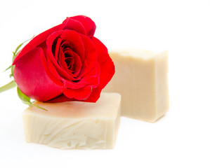 Traditional rose soap made by hand suggesting natural healthy washing product on a white isolated background
