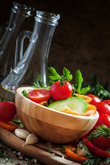 Salad with bell pepper, tomato, cucumber, garlic, herbs and oliv