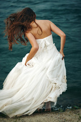 Fototapeta na wymiar Woman in White near Stormy Sea
