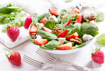  salad with strawberry, spinach leaves and feta cheese