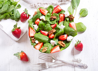 salad with strawberry, spinach leaves and feta cheese