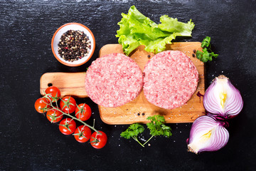 fresh raw beef burger for hamburger with vegetables
