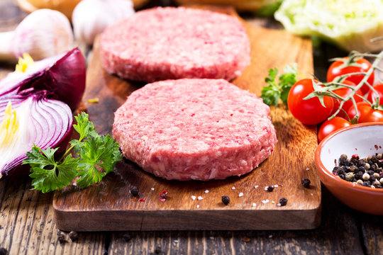 fresh raw beef burger for hamburger with vegetables