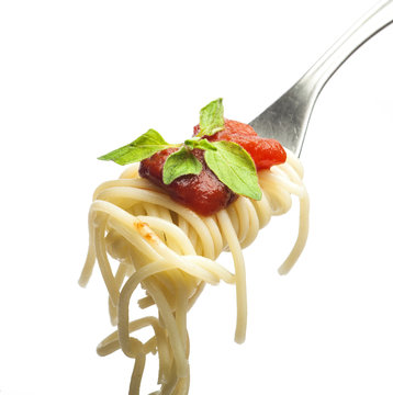 Fork with spaghetti sauce and oregano
