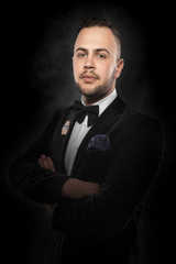 Young handsome man in black suit.