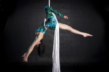 Aerialist doing tricks on silks