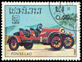 Fototapeta na wymiar Stamp printed in Laos shows vintage car Nazzaro