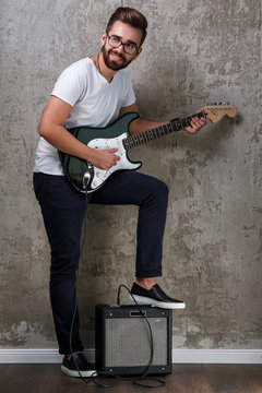 Stylish guy with a guitar