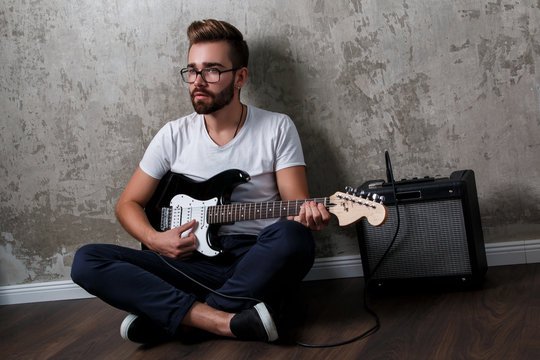 Stylish guy with a guitar