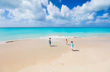 Mother and kids at tropical beach