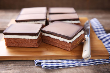 Delicious chocolate brownies on wooden background
