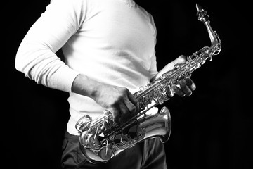 African American jazz musician playing the saxophone, closeup