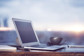 Laptop and coffee cup