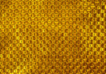 golden texture of leather braiding. golden background.
