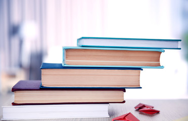 Heart bookmark for book on wooden table closeup