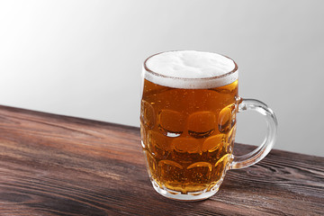 Glass of beer on white background