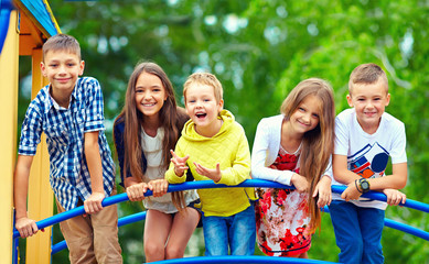 happy excited kids having fun together on playground