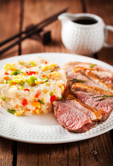 Fried duck  and rice with vegetables and eggs