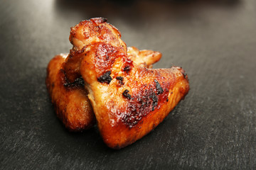 Baked chicken wings on slate plate