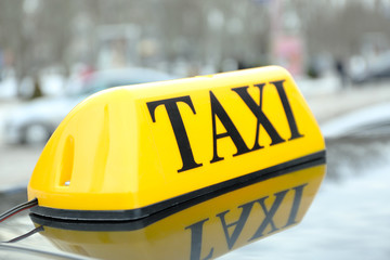 Taxi sign on car, closeup