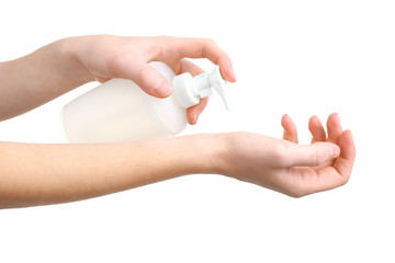 Naklejka premium Beautiful female hands applying hand cream, isolated on white