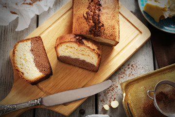 Composition of tasty cake on cutting board, closeup