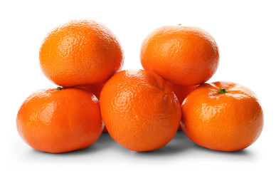 A pile of fresh tangerines isolated on white background, close up