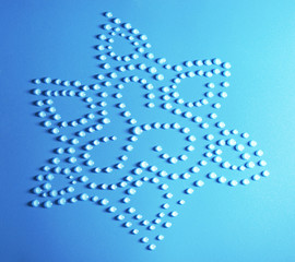Flower made of water drops on blue background