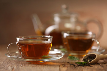 Cups of tea on wooden table