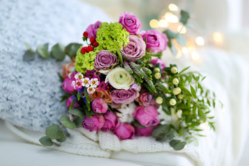 Bouquet of roses on a woolen blanket, closeup