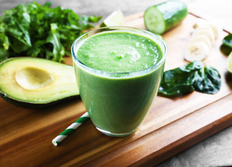 Fresh avocado smoothie on wooden board