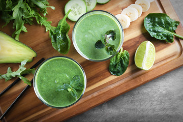 Fresh avocado smoothies on wooden board