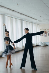 Professional dancers dancing in ballroom. Latin. 