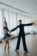 Professional dancers dancing in ballroom. Latin. 