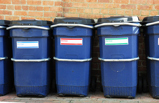 outdoor trash bins in a row
