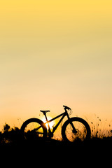 Fototapeta na wymiar silhouette fat bike at sunset, fat tire bike at sunset