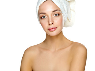 Beautiful woman with a towel on his head on a white background