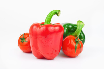 Wet red and green peppers and tomatoes