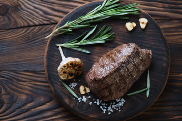 Above view of a rustic serving board with grilled asado steak