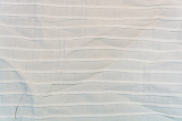 The texture, background of white cotton striped fabric