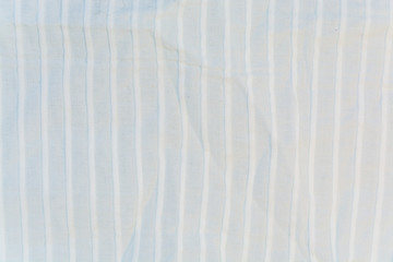 The texture, background of white cotton striped fabric