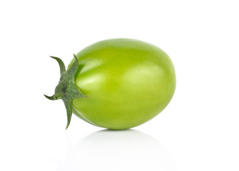 green tomato on white background