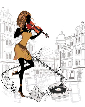 Girl musician playing the violin in the streets