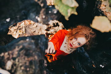 tale. fantastic redhead girl in a mysterious forest